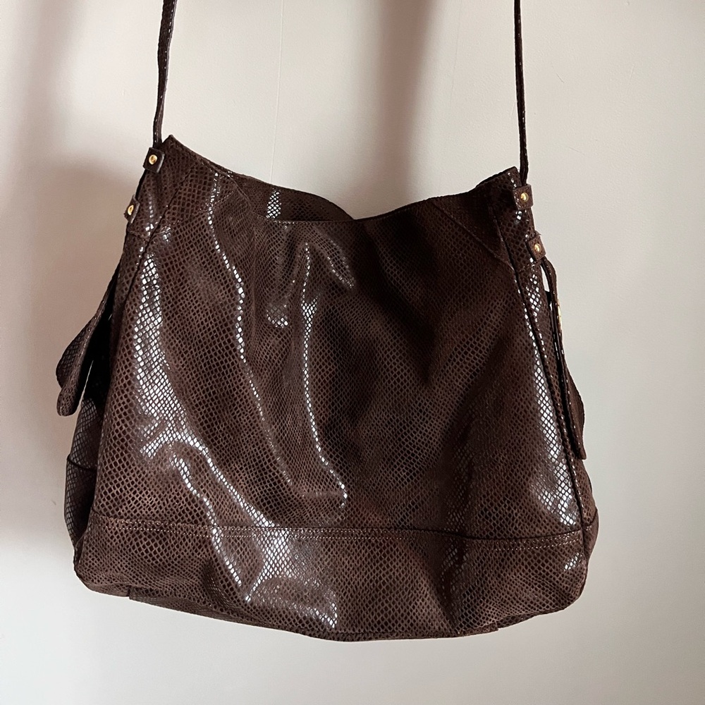 Brown snakeskin leather shoulder bag. Can fit a laptop. Zipper closure.